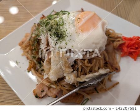 Yakisoba with a fried egg on top Yakisoba with a fried egg on top 142207681