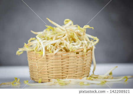 Mung bean sprout for food - bean sprouts cup on wooden Background Mung bean sprout for food - bean sprouts cup on wooden Background 142208921