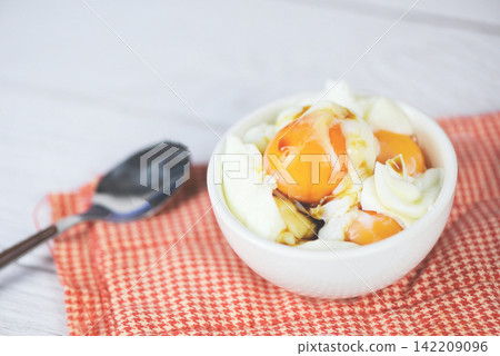 boiled egg on bowl with sauce for breakfast on the table background - Soft boiled eggs 142209096