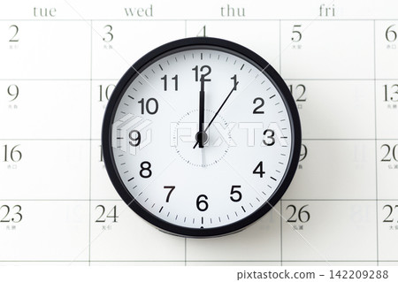 A clock and calendar showing 12 o'clock 142209288