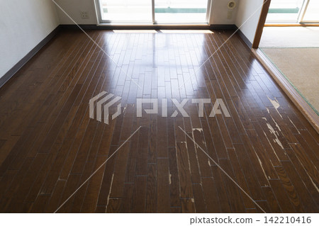 Damaged and scratched flooring before renovation; replacement. Damaged and scratched flooring before renovation; replacement. 142210416