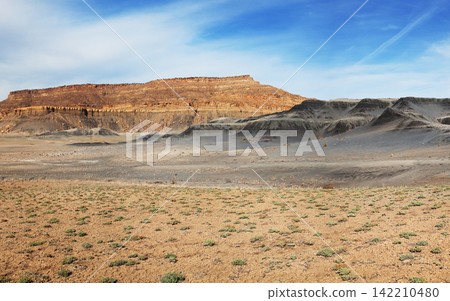 Desert Badlands Landscape with Mesas and Blue Sky Desert Badlands Landscape with Mesas and Blue Sky 142210480