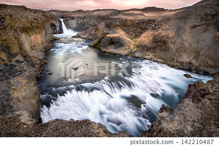 Waterfall and Volcanic River Canyon in Dramatic Landscape Waterfall and Volcanic River Canyon in Dramatic Landscape 142210487