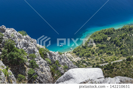 Turquoise Sea Cove and Rocky Mediterranean Coastline Turquoise Sea Cove and Rocky Mediterranean Coastline 142210631