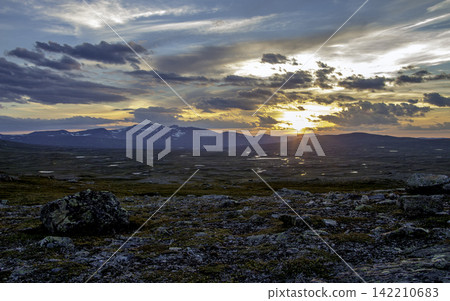 Mountain Sunset Panorama with Dramatic Clouds and Rocky Wilderness Mountain Sunset Panorama with Dramatic Clouds and Rocky Wilderness 142210683