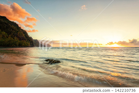 Tropical Beach Sunset with Ocean Waves and Coastal Cliffs Tropical Beach Sunset with Ocean Waves and Coastal Cliffs 142210736