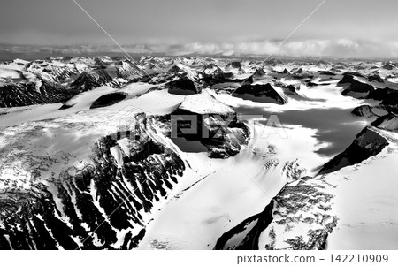 Snowy Mountain Range in Black and White Aerial Panorama Snowy Mountain Range in Black and White Aerial Panorama 142210909