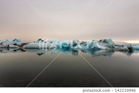 Icebergs in Glacial Lagoon with Calm Water Reflections Icebergs in Glacial Lagoon with Calm Water Reflections 142210946