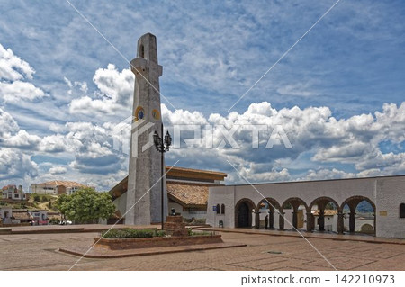 Colonial Church Bell Tower in Historic Plaza Under Cloudy Sky Colonial Church Bell Tower in Historic Plaza Under Cloudy Sky 142210973