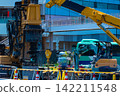 A crane at a construction site in an urban area [Construction image] 142211548