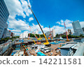 A crane at a construction site in an urban area [Construction image] 142211581