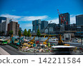 A crane at a construction site in an urban area [Construction image] 142211584
