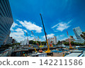 A crane at a construction site in an urban area [Construction image] 142211586
