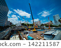 A crane at a construction site in an urban area [Construction image] 142211587