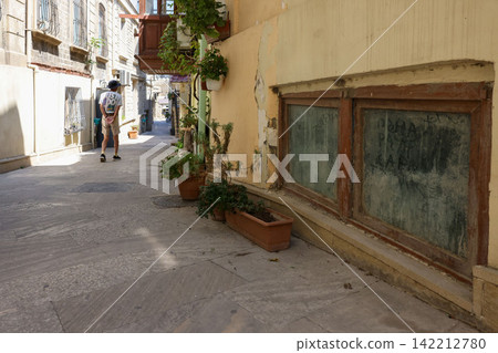 A narrow street in the old city of Baku, Azerbaijan. A narrow street in the old city of Baku, Azerbaijan. 142212780