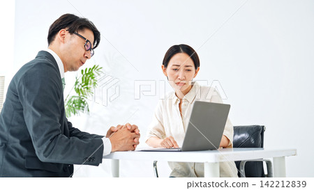 A man and a woman having a meeting. Customer service, consultation, worries, questions, problems, anxiety, concerns, business, PC, explanation, customer, proposal, woman, man A man and a woman having a meeting. Customer service, consultation, worries, questions, problems, anxiety, concerns, business, PC, explanation, customer, proposal, woman, man 142212839