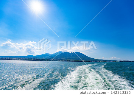 Mount Unzen and the wake of a ship as seen from the sea. Mount Unzen and the wake of a ship as seen from the sea. 142213325