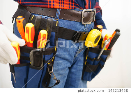 Male builder worker with tool belt pocket at waist. Male builder worker with tool belt pocket at waist. 142213438