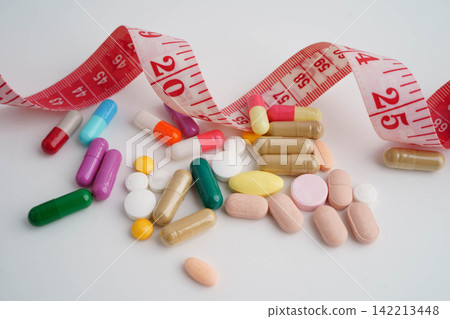 Measuring tape and tablet drug medical for diet. Measuring tape and tablet drug medical for diet. 142213448