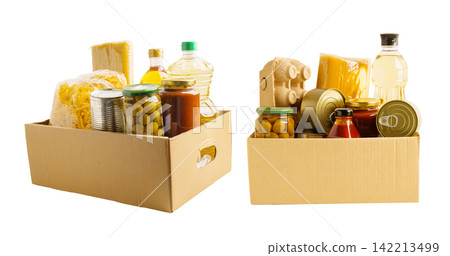 Foodstuffs in donation box isolated on white background. Foodstuffs in donation box isolated on white background. 142213499