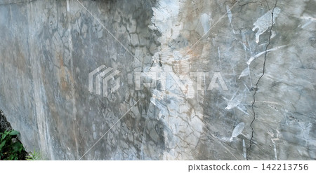 Old concrete wall with cracks and peeling paint. Old concrete wall with cracks and peeling paint. 142213756