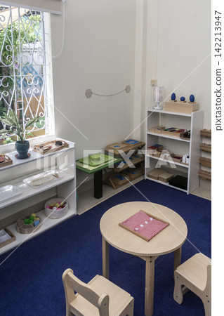 Montessori educational learning materials and equipment for young children in school interior Montessori educational learning materials and equipment for young children in school interior 142213947