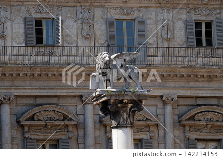 St. Mark's Lion, symbol of the Republic of Venice on a white marble column at the Piazza delle Erbe in Verona, Italy 142214153