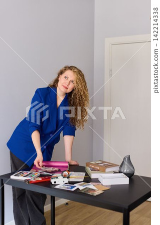 Caucasian workshop instructor preparing craft materials 142214338