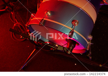 Roadie prepares drum hardware with visible signs of use Roadie prepares drum hardware with visible signs of use 142214374