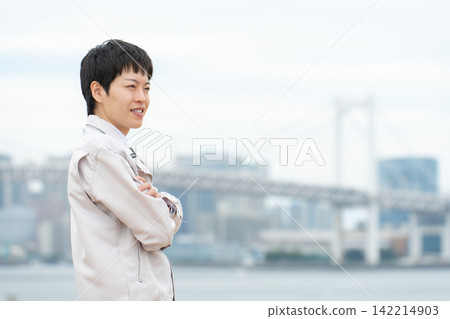 Man in work clothes, real estate, side view Man in work clothes, real estate, side view 142214903
