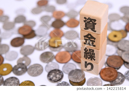 A textbook on cash flow management and Japanese yen coins A textbook on cash flow management and Japanese yen coins 142215814