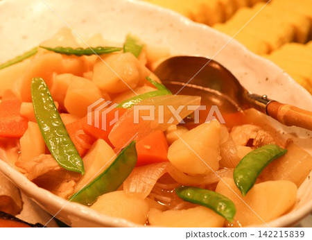 A hearty bowl of nikujaga (meat and potato stew) is served at the hotel's Japanese buffet. The vegetables and snow peas, infused with the flavorful broth, create a vibrant and popular home-style dish. 142215839