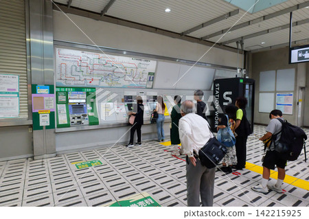Japanese railway station ticket gates leading to train platform 142215925