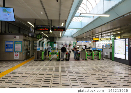Japanese railway station ticket gates leading to train platform Japanese railway station ticket gates leading to train platform 142215926