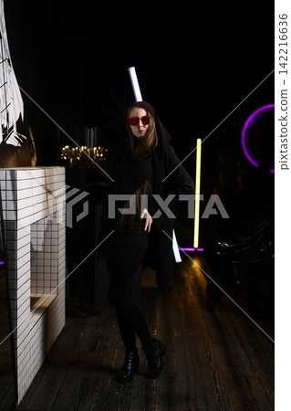 Dynamic performer illuminated by neon hues in urban setting Dynamic performer illuminated by neon hues in urban setting 142216636