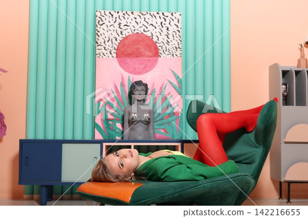 Caucasian female posed in colorful pop art setting with natural elements Caucasian female posed in colorful pop art setting with natural elements 142216655