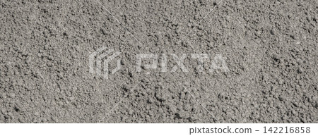 Gray gravel surface creating a textured background Gray gravel surface creating a textured background 142216858