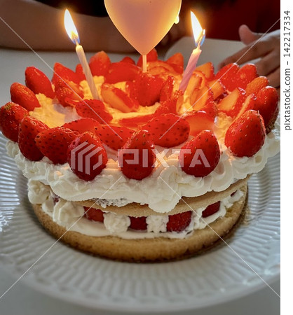 The moment of blowing out the homemade birthday cake The moment of blowing out the homemade birthday cake 142217334