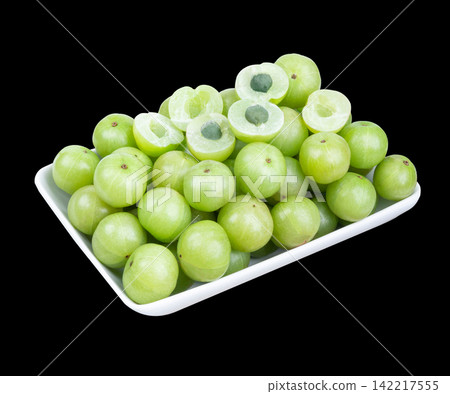 Indian gooseberry fruits or Amla berry ( phyllanthus emblica )  in plate on  back background. 142217555