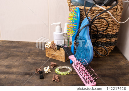 Combs and hair clips in the bathroom. Hair Styling Tools and Accessories on Table Combs and hair clips in the bathroom. Hair Styling Tools and Accessories on Table 142217628