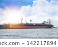 A large ocean-going vessel is docked for maintenance. 142217894