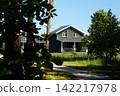 Modern country cottages surrounded by trees and greenery. A vacation resort. 142217978