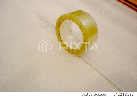 Transparent Adhesive Tape Rests on a Clean Surface Ready for Everyday Tasks 142218182
