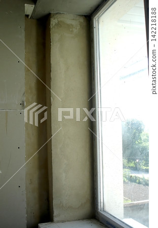 Unfinished Window Slope With Fresh Plaster Ready for Final Touches Unfinished Window Slope With Fresh Plaster Ready for Final Touches 142218188