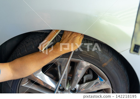 Removing dents on the car. PDR technology. Car body repair without painting. Removing dents on the car. PDR technology. Car body repair without painting. 142218195