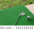 Golf Club and Ball on Turf Mat with Grass Border 142218243