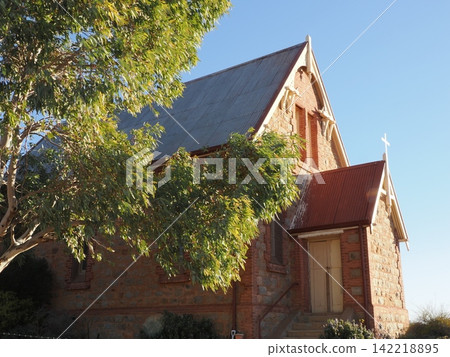 St. Casage Church in Silverton—A historic inland chapel landscape marked by its brick exterior and cross. St. Casage Church in Silverton—A historic inland chapel landscape marked by its brick exterior and cross. 142218895