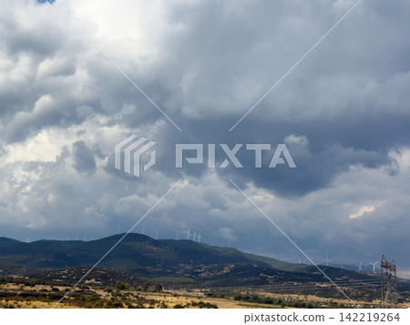 Stormy Mountain Landscape Beneath Heavy Dramatic Gray Clouds Stormy Mountain Landscape Beneath Heavy Dramatic Gray Clouds 142219264