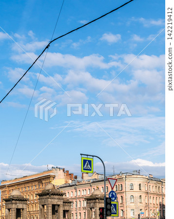 electric wires and cables in blue sky above city electric wires and cables in blue sky above city 142219412