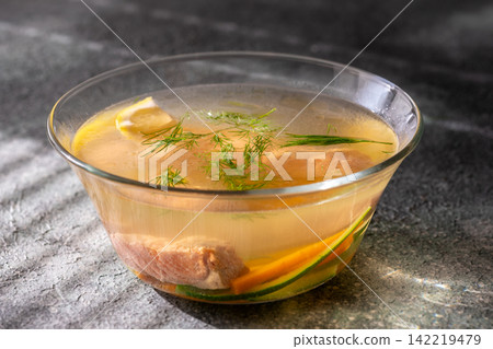 Transparent Salmon Soup With Fresh Dill Lemon And Vegetables In Glass Bowl Elegantly Transparent Salmon Soup With Fresh Dill Lemon And Vegetables In Glass Bowl Elegantly 142219479